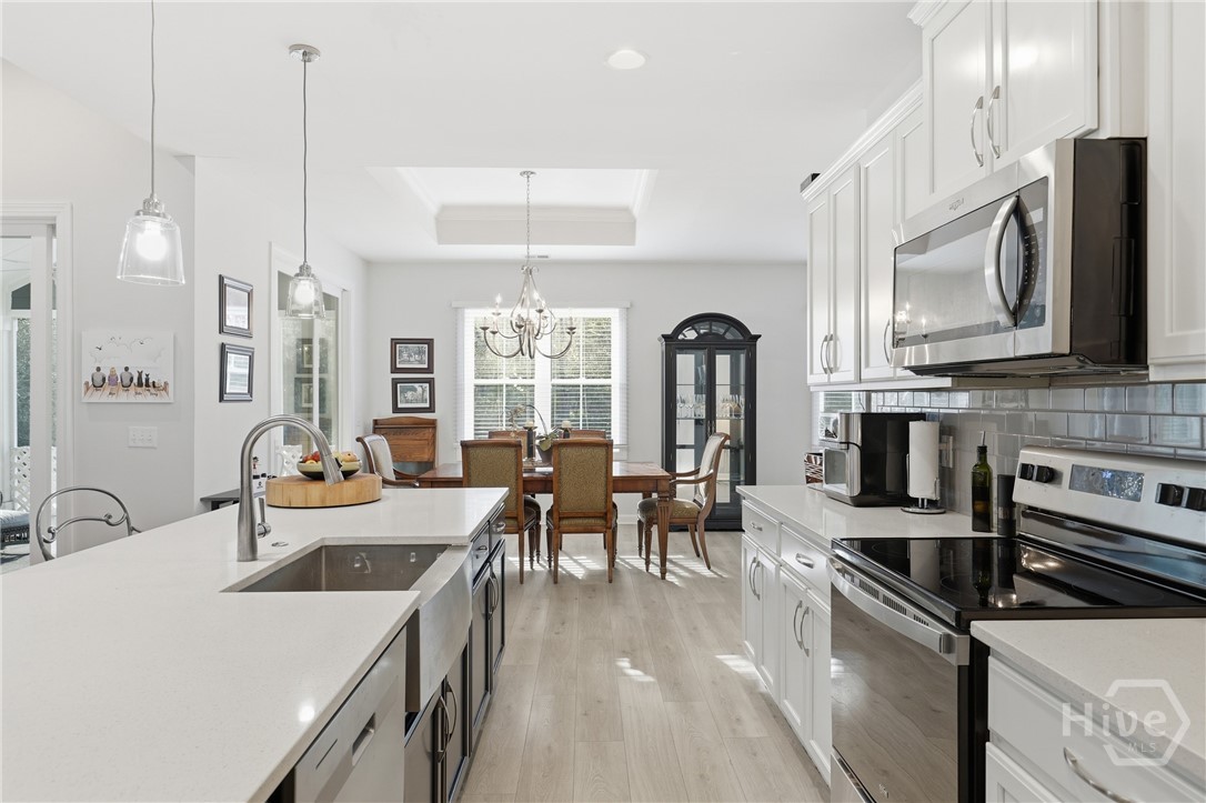 119 Bramswell Road Pooler, GA 31322 - Photo 12 of 35 Kitchen view to dining room and backyard beyond.