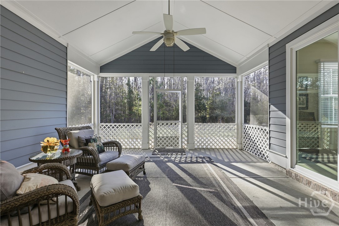 119 Bramswell Road Pooler, GA 31322 - Photo 26 of 36 Screened porch leading to outdoor paver deck.