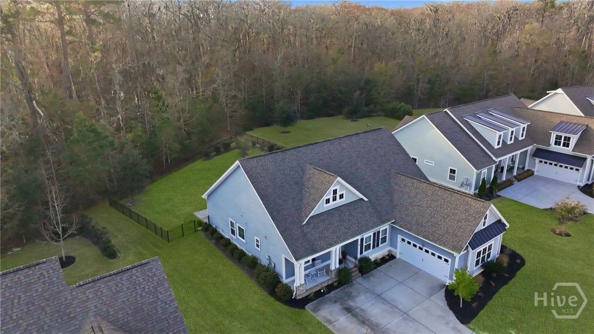 119 Bramswell Road Pooler, GA 31322 - Photo 5 of 35 Aerial view of home with protected woodlands beyond large backyard.
