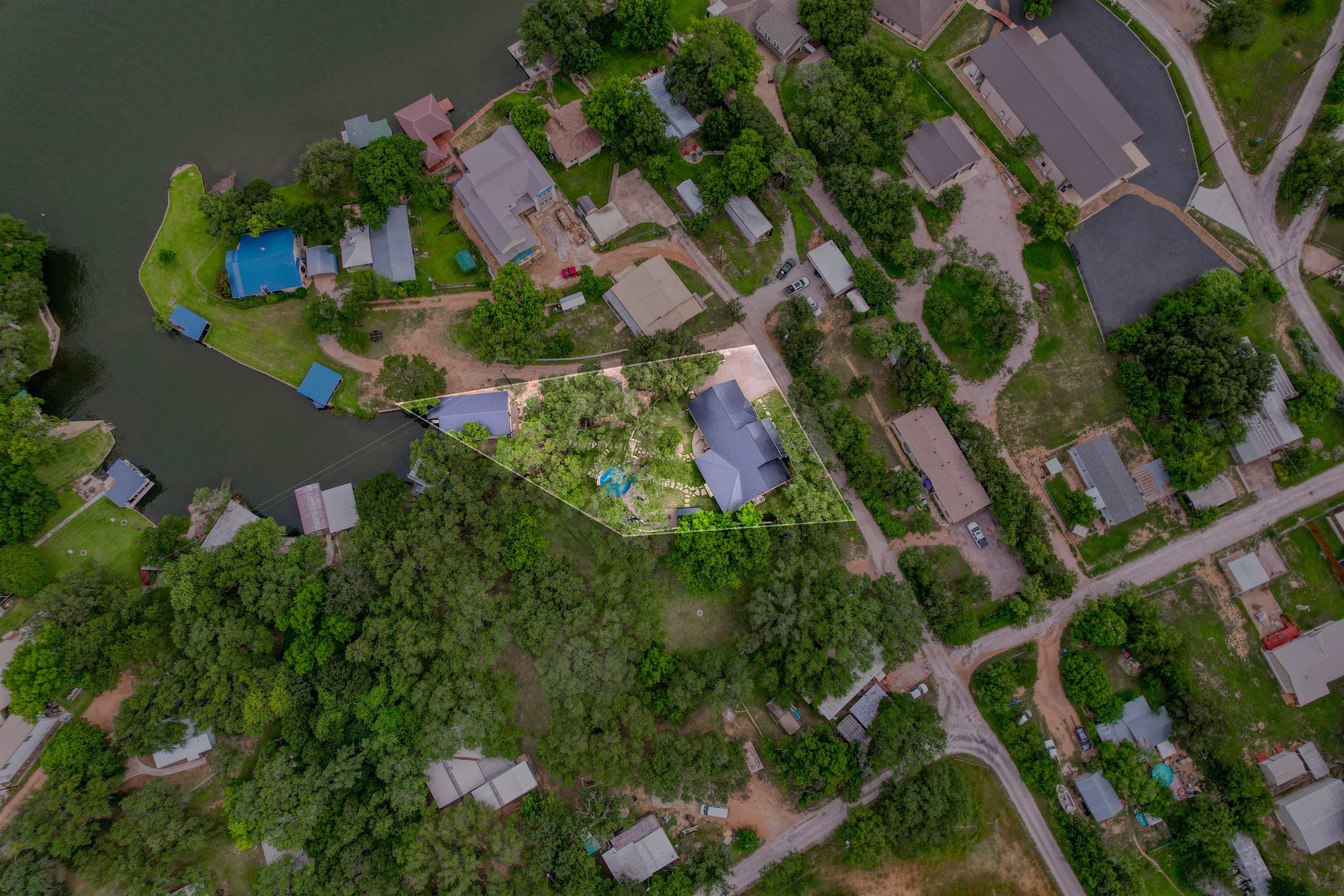 2001 Granite Cove Road Kingsland, TX 78639 - Photo 2 of 42 an aerial view of residential house with outdoor space and trees all around