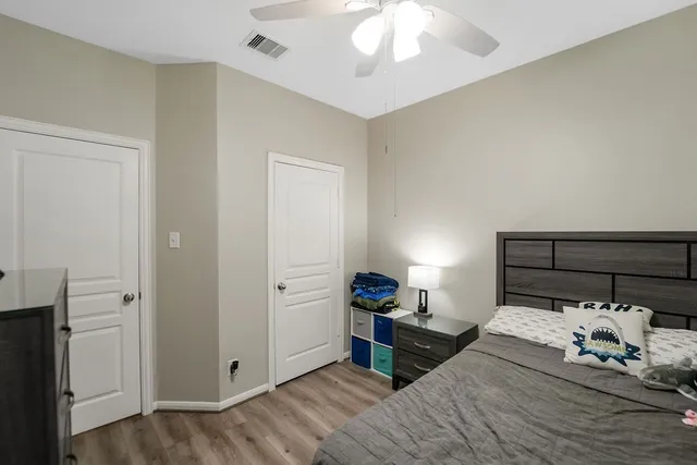 a bed room with a bed and a chandelier