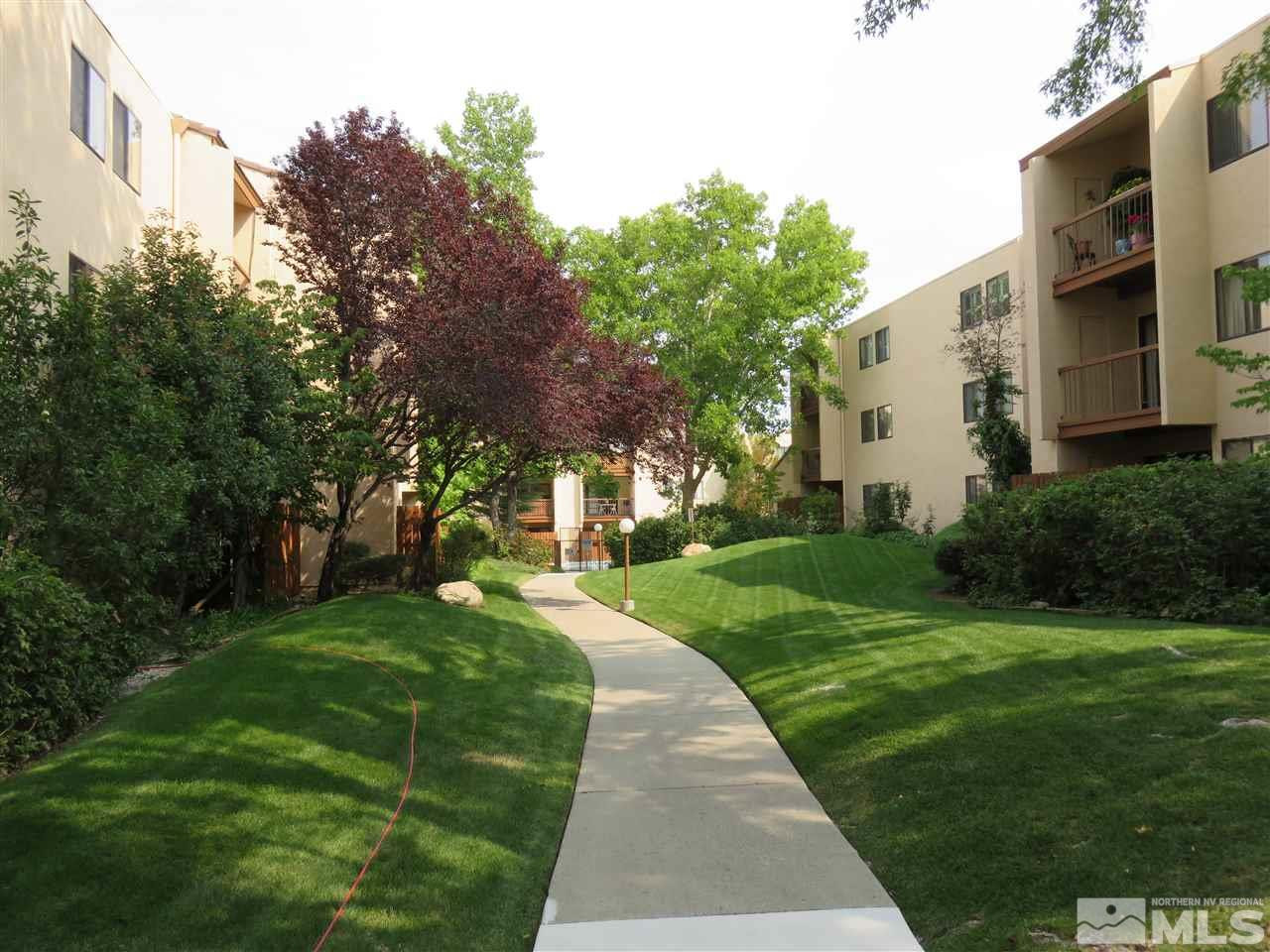 2750 Plumas Street, Unit 300 Reno, NV 89509 - Photo 1 of 1 a view of a white house with a yard