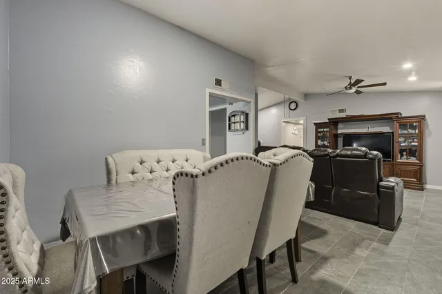 a dining room with furniture and window