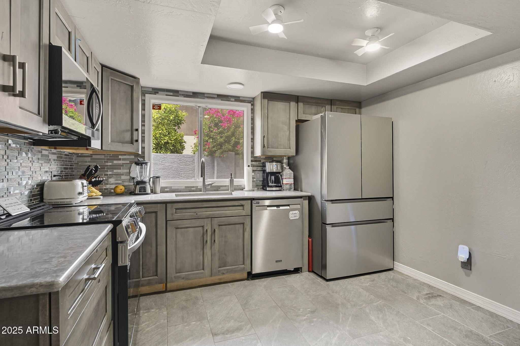 2103 West Palomino Drive Chandler, AZ 85224 - Photo 13 of 46 a kitchen with a refrigerator sink and stove