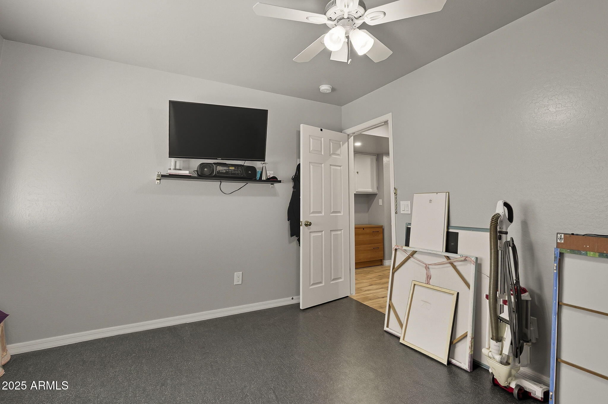 2103 West Palomino Drive Chandler, AZ 85224 - Photo 24 of 46 a view of a room with gym equipment and a flat screen tv
