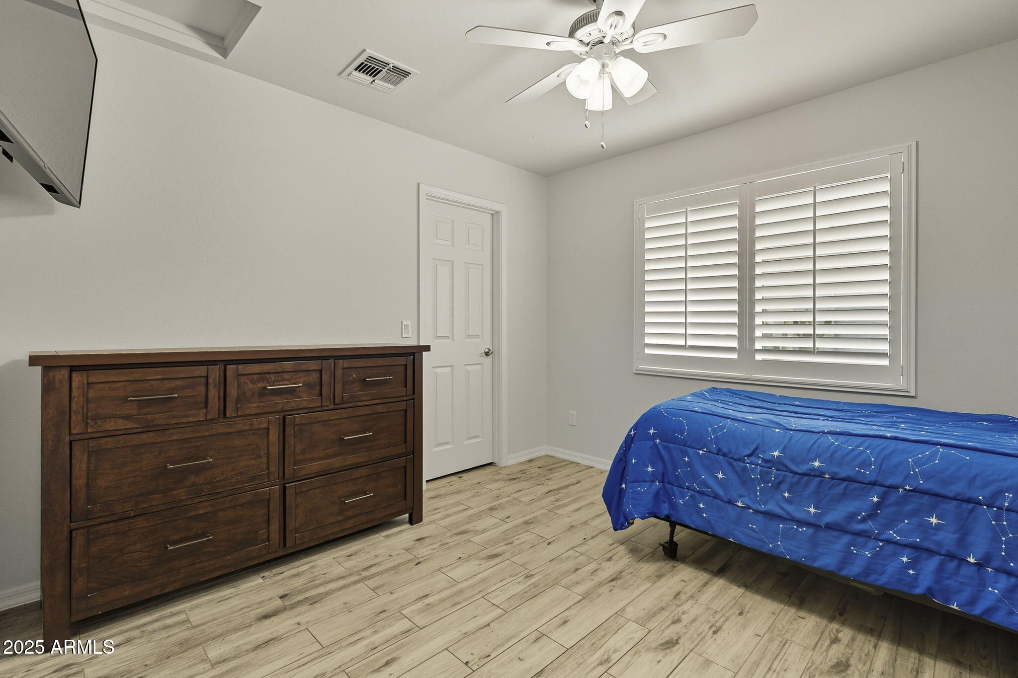 2103 West Palomino Drive Chandler, AZ 85224 - Photo 27 of 46 a bedroom with a bed and a dresser