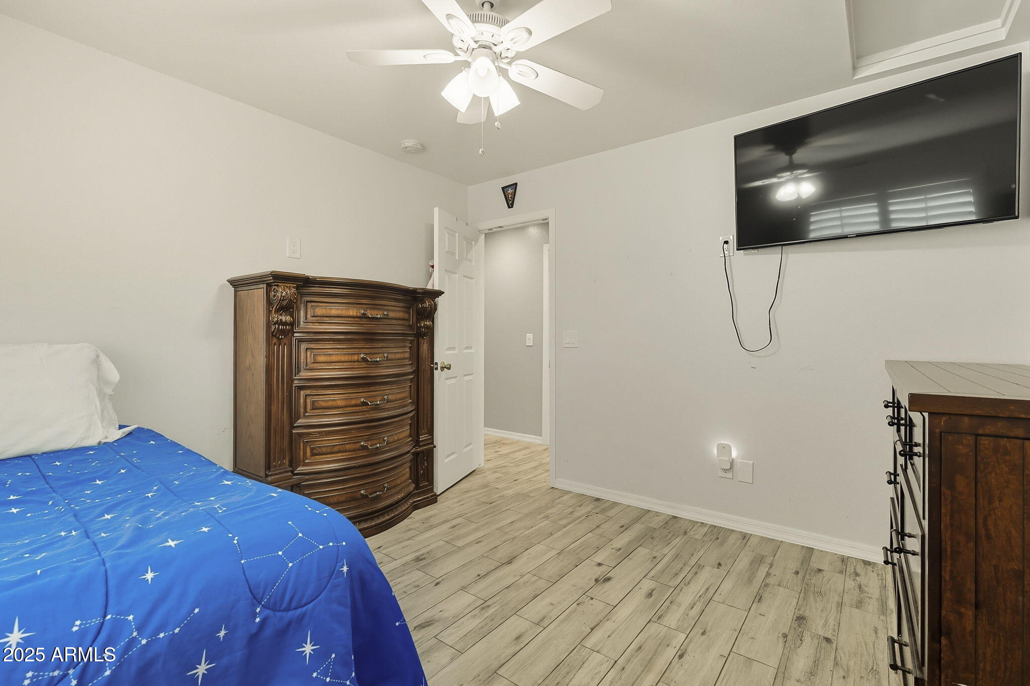 2103 West Palomino Drive Chandler, AZ 85224 - Photo 28 of 46 a bedroom with a bed and a flat screen tv