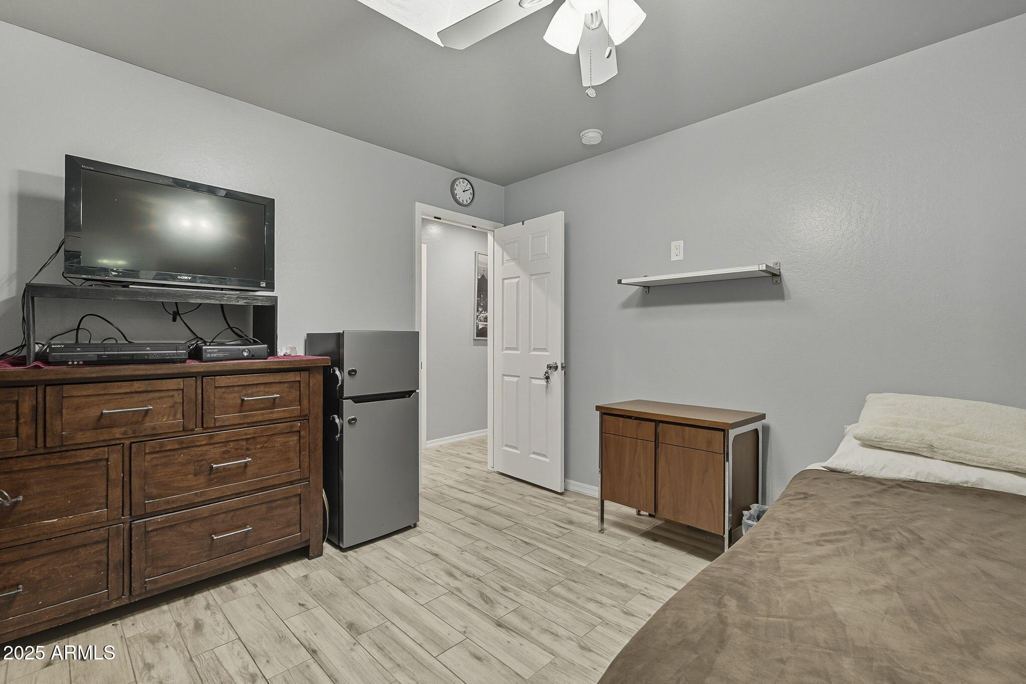 2103 West Palomino Drive Chandler, AZ 85224 - Photo 30 of 46 a room with a bed and a flat screen tv