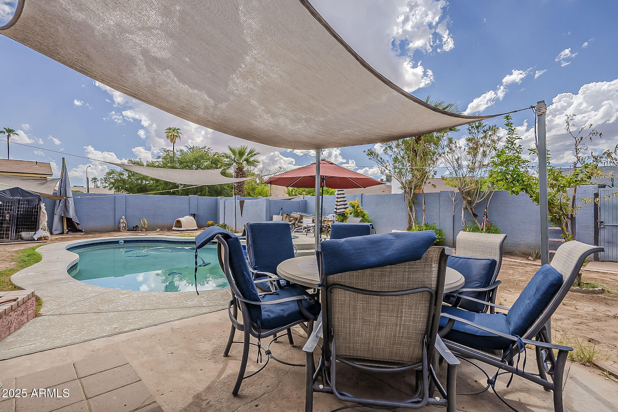 2103 West Palomino Drive Chandler, AZ 85224 - Photo 37 of 46 a patio with yard table and chairs