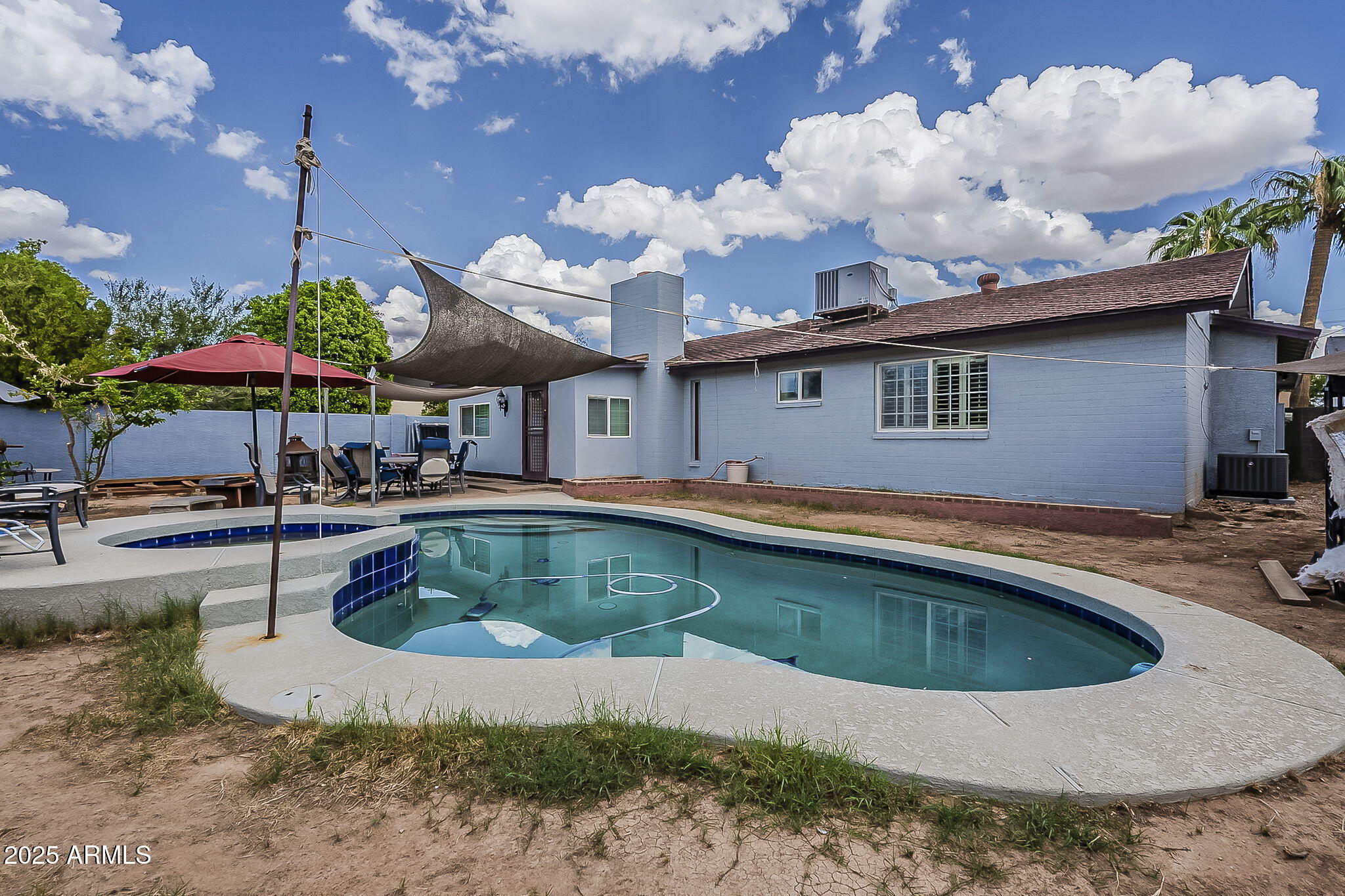 2103 West Palomino Drive Chandler, AZ 85224 - Photo 43 of 46 a view of a house with pool and chairs