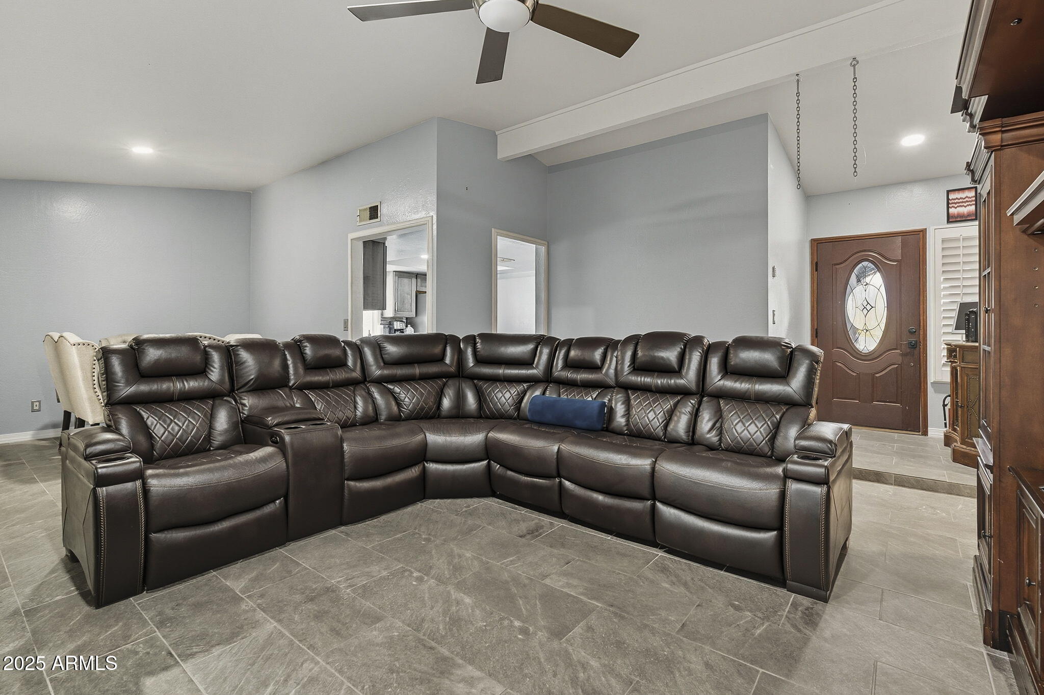2103 West Palomino Drive Chandler, AZ 85224 - Photo 7 of 46 a living room with a couch and a ceiling fan