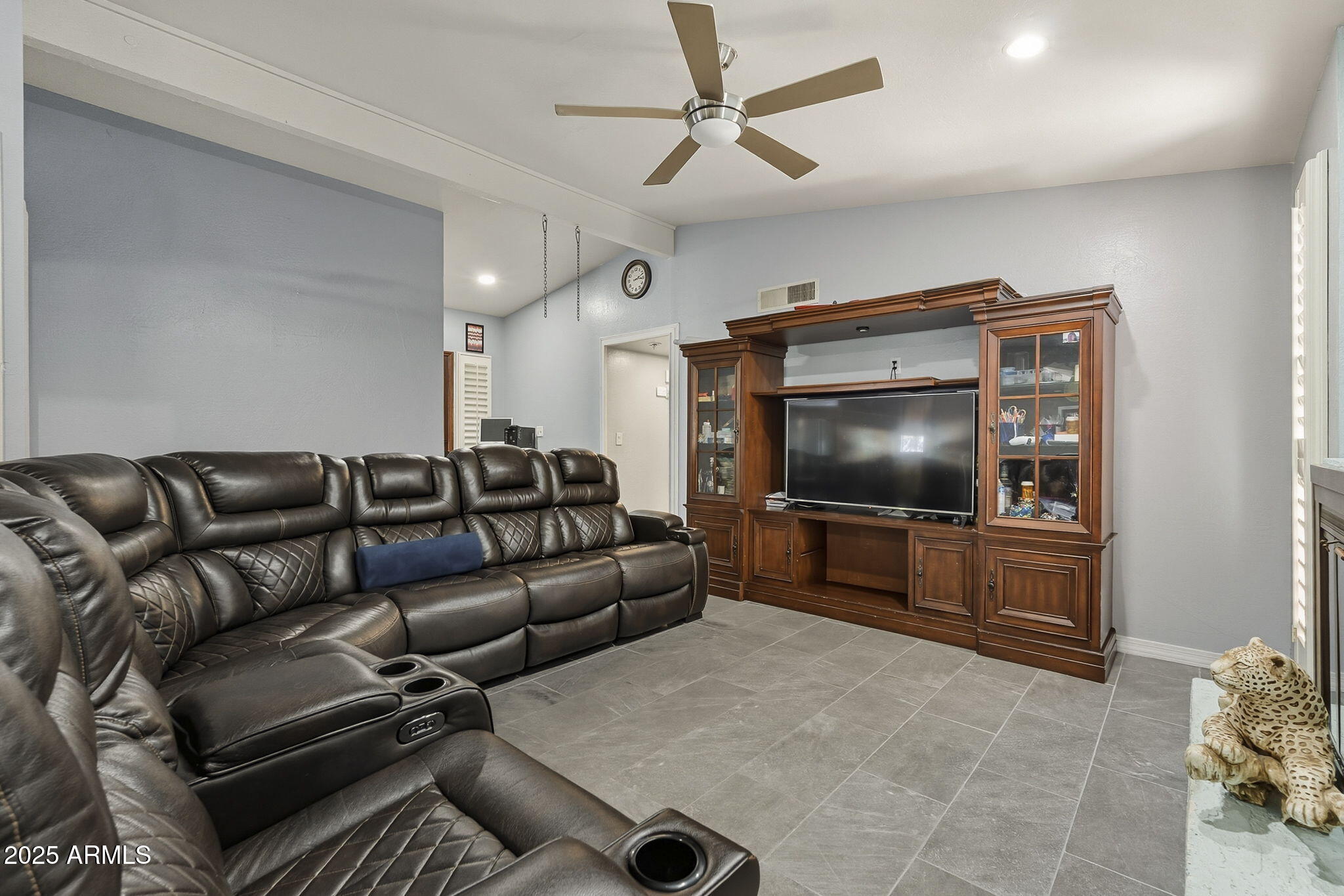 2103 West Palomino Drive Chandler, AZ 85224 - Photo 8 of 46 a living room with furniture and a flat screen tv