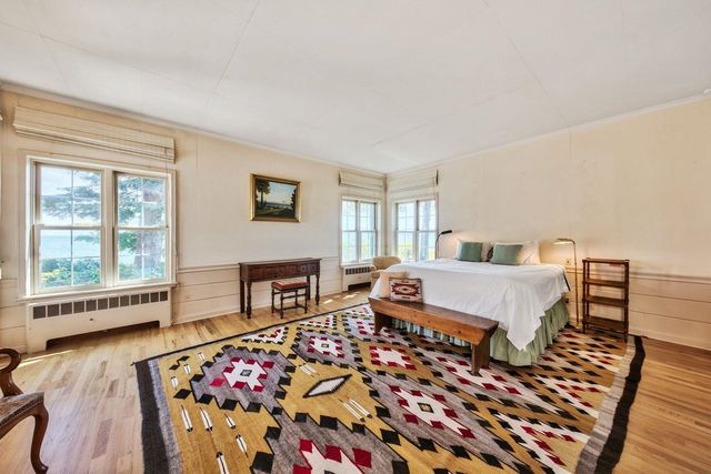 a bedroom with furniture and a window