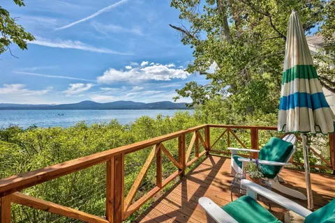 a view of a balcony with chairs