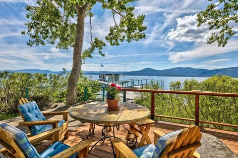 a view of a chairs and table in patio