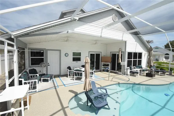 a building outdoor space with patio furniture and outdoor view