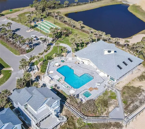an aerial view of a house with a swimming pool
