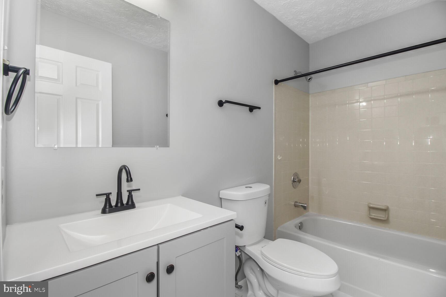 408 Sutton Place Abingdon, MD 21009 - Photo 16 of 26 a bathroom with a sink a toilet and shower