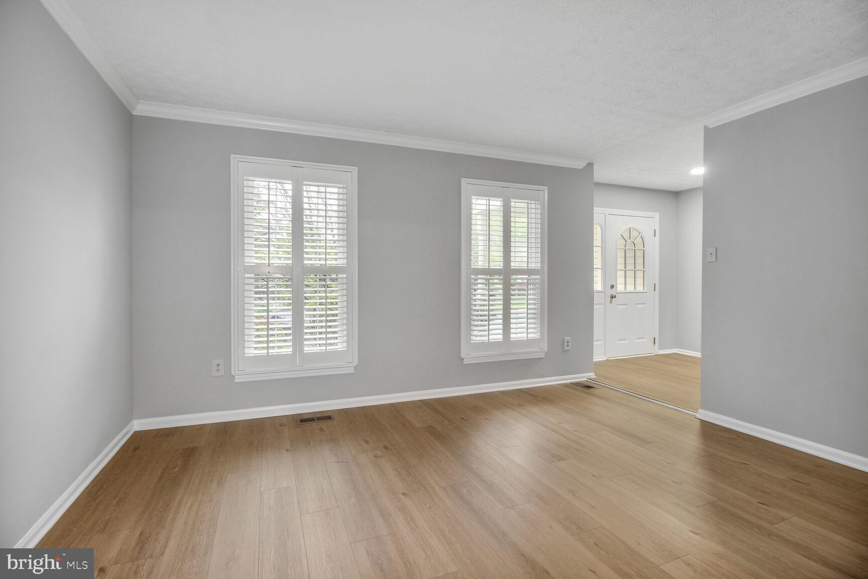 408 Sutton Place Abingdon, MD 21009 - Photo 5 of 26 an empty room with wooden floor and windows