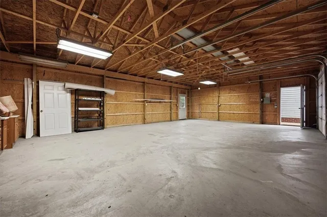 a view of an empty room with a garage