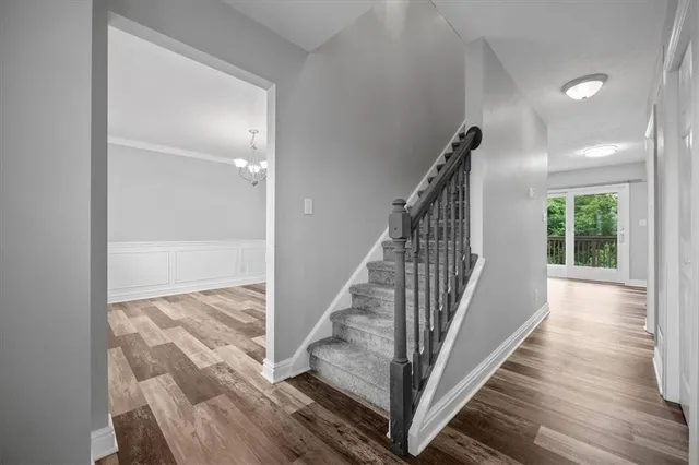 a view of entryway with wooden floor