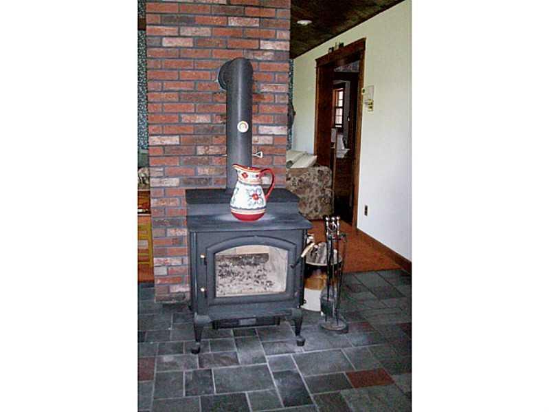 166 Sam Annis Road Hartford, ME 04220 - Photo 9 of 31 Dining Room. Wood stove in dining room