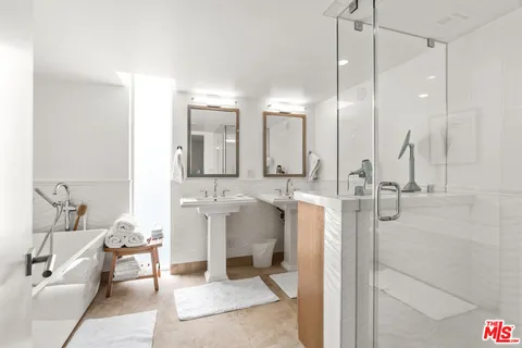 a bathroom with a double vanity sink mirror and