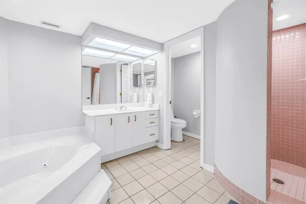 a bathroom with a bathtub sink and toilet
