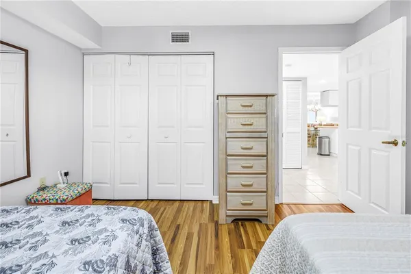 a bedroom with a bed and a closet