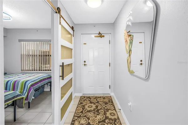 a view of bedroom with a bed and a window