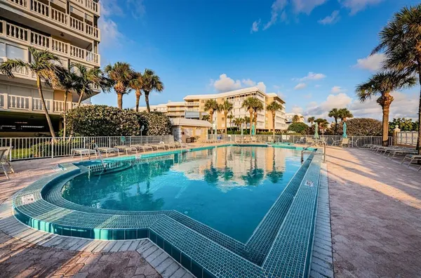 a view of a swimming pool with a patio
