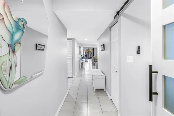 a view of a hallway with seating area