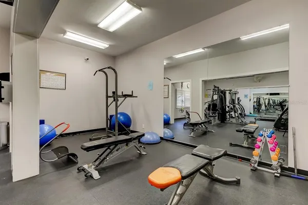 a room with gym equipment and gym equipment
