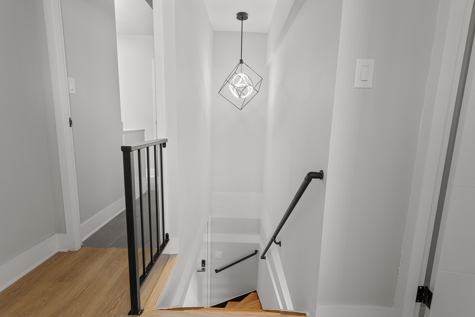 6166 North Sheridan Road, Unit 20C Chicago, IL 60660 - Photo 12 of 19 a view of a hallway with wooden floor and staircase