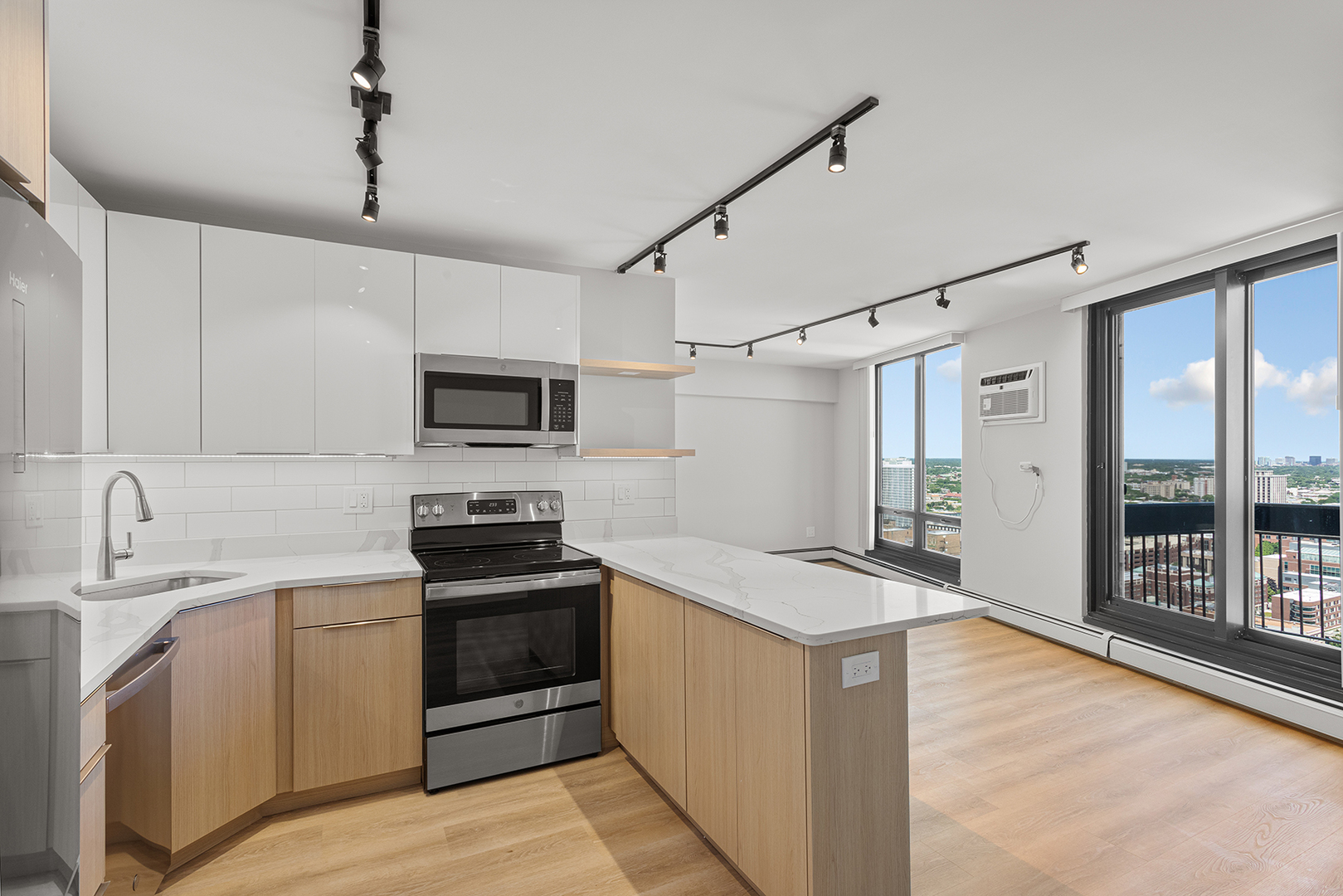 6166 North Sheridan Road, Unit 20C Chicago, IL 60660 - Photo 5 of 19 a kitchen with granite countertop a sink stove and refrigerator