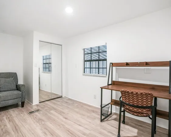 a view of a livingroom with furniture and wooden floor