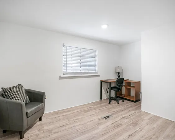 a view of livingroom with furniture and window