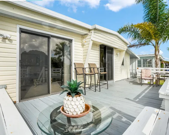 a view of a dinning room with a table and chairs