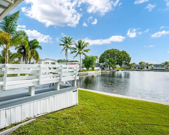 a view of a lake with a big yard