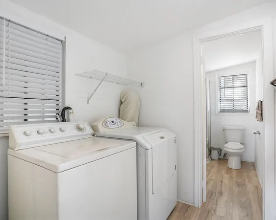 a view of bathroom with a washer and dryer