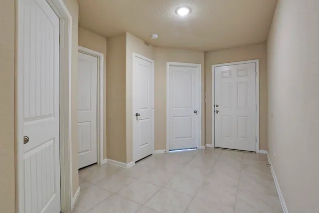 an empty room with closet area