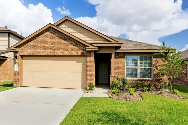 a view of house with backyard