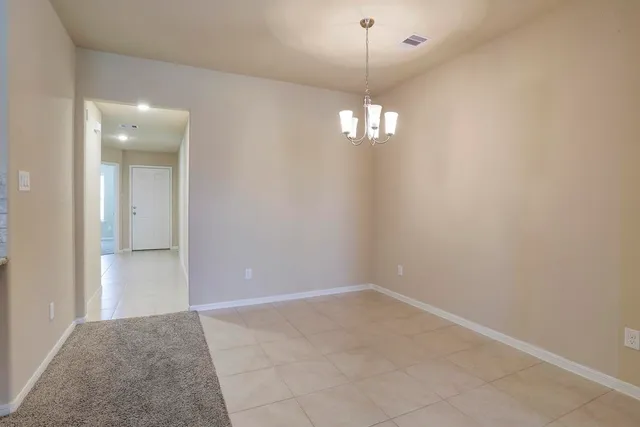 a view of a chandelier in a room and chandelier
