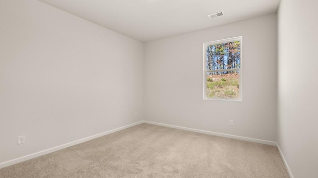 113 Crooked Lk Park Villa Rica, GA 30180 - Photo 11 of 30 an empty room with windows