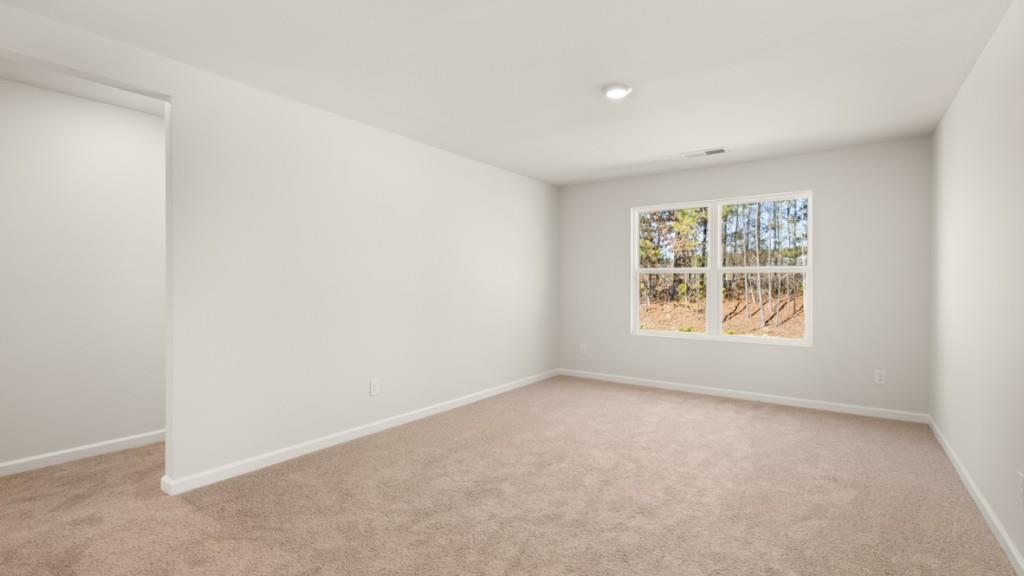 113 Crooked Lk Park Villa Rica, GA 30180 - Photo 13 of 30 an empty room with windows