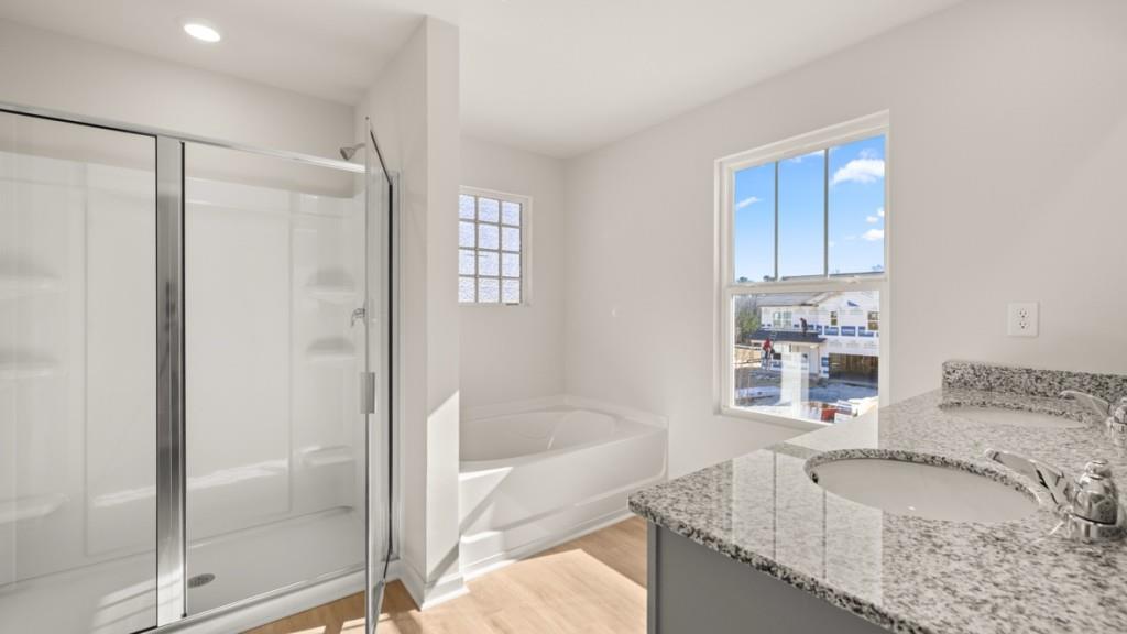 113 Crooked Lk Park Villa Rica, GA 30180 - Photo 19 of 30 a bathroom with a granite countertop tub sink and mirror