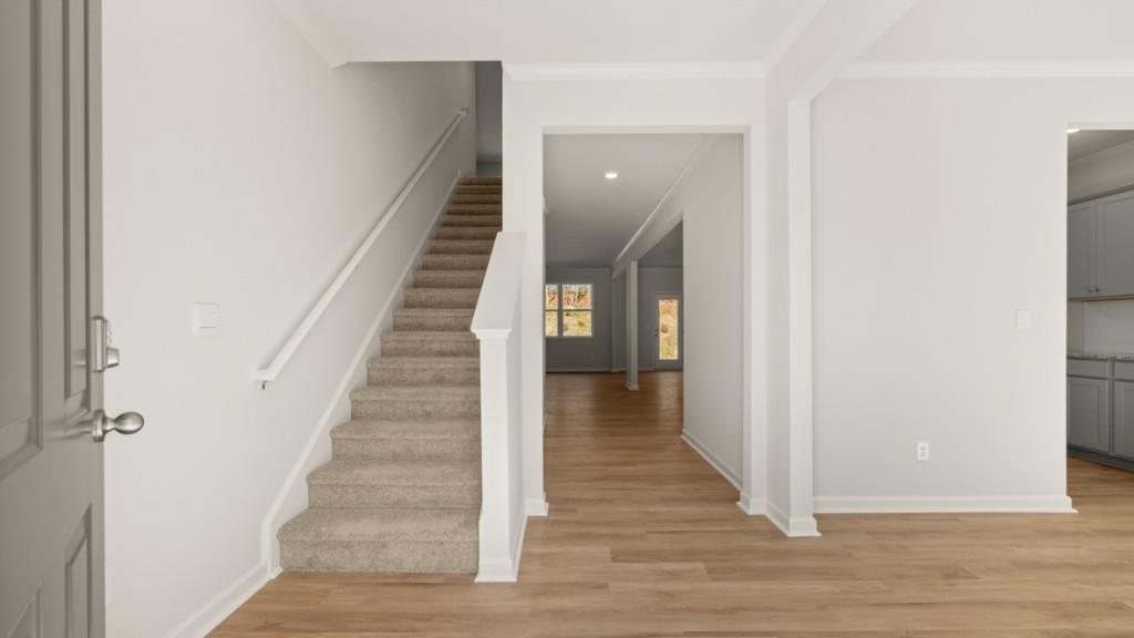 113 Crooked Lk Park Villa Rica, GA 30180 - Photo 2 of 30 a view of a hallway with wooden floor and entryway