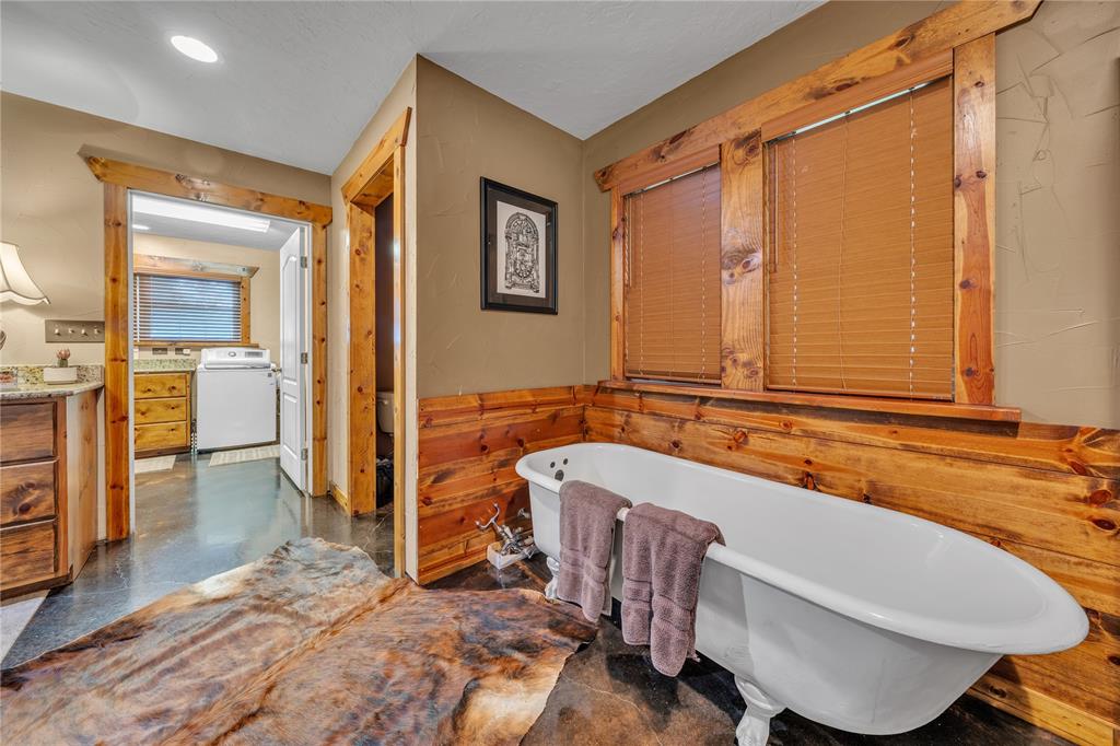 209 Dixie Road Millsap, TX 76066 - Photo 30 of 31 a spacious bathroom with a tub and shower