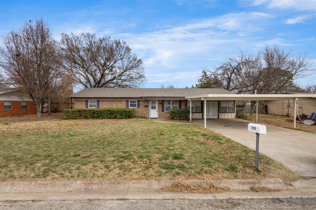 705 Pillar Street Bowie, TX 76230 - Photo 1 of 1 a front view of a house with a yard