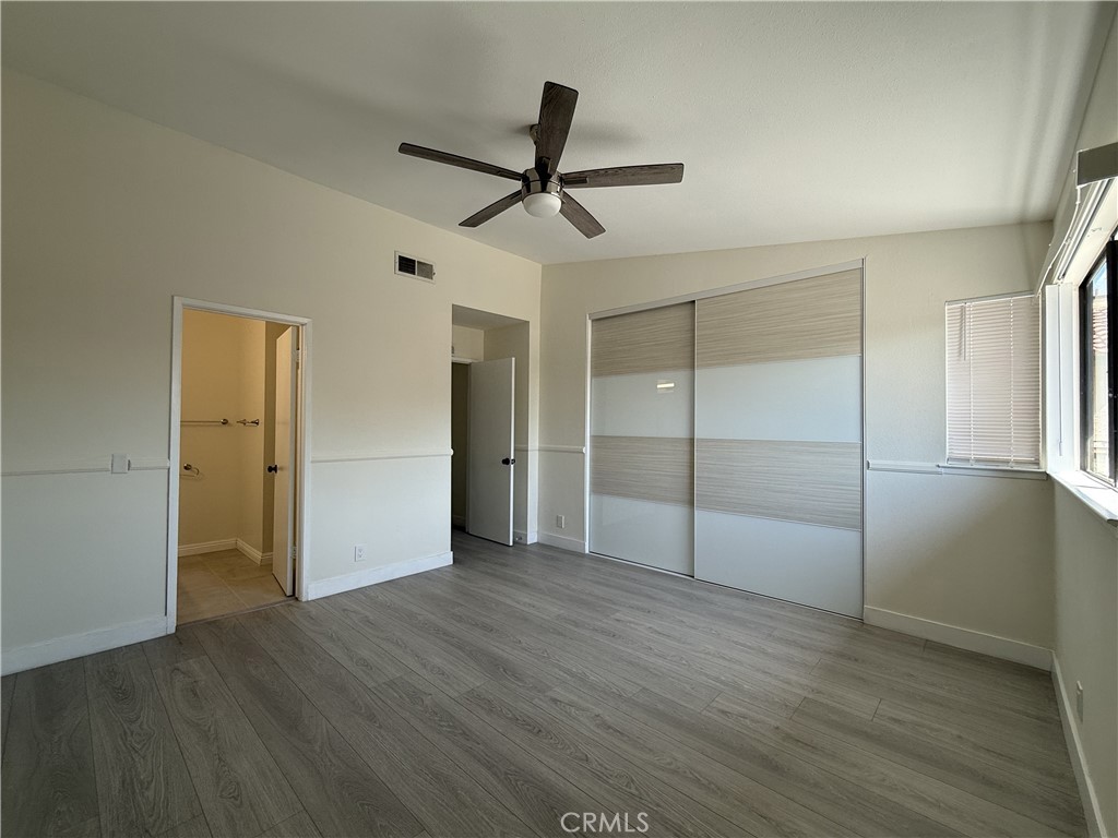 9860 Galena Court Rancho Cucamonga, CA 91730 - Photo 5 of 6 a view of empty room with wooden floor and ceiling fan